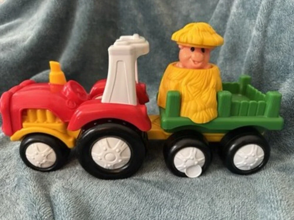 This 2007 Fisher-Price Little People Tow 'n Pull Tractor